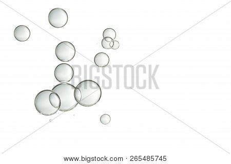 Water Drops Isolated Over A White Surface.