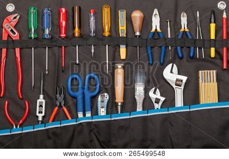 Toolbelt with set of tools - screwdrivers ruler nippers  wrenches pliers pencil  cutter scissors brush chisel - DIY consept