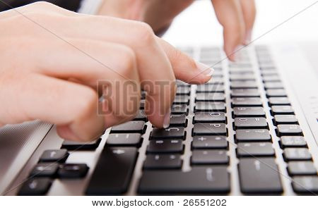 Close-up of secretaryÂ´s hand touching computer keys during work