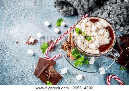 Homemade Hot Chocolate With Mint, Candy Cane And Marshmallow, Light Blue Background With Warm Blanke