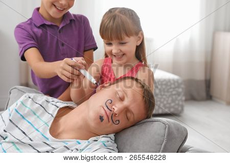 Children Painting Their Father's Face While He Sleeping On April Fool's Day