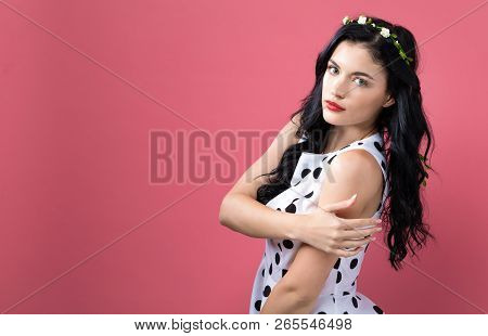 Fashionable Woman With A Garland On A Pink Background
