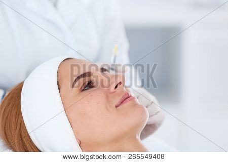 Woman Undergoing Face Biorevitalization Procedure In Salon, Closeup. Cosmetic Treatment