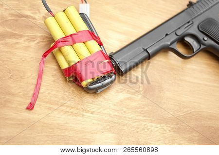 A Bomb Connected With Mobile Phone And A Handgun, Conceptr Of Terrorism, Studio Closeup