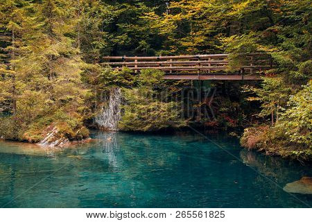 Autumn Time At Romantic Forest Lake Blausee, One Of The Best Known Mountain Lakes In Switzerland.