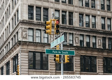 Street Name And Road Signs On A Lamp Post On The Corner Of Park Avenue South And 17th East Street In