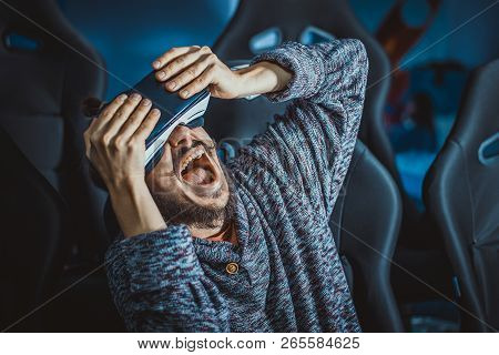 Man In Virtual Glasses Is Watching A Movie In 5D In A Cinema