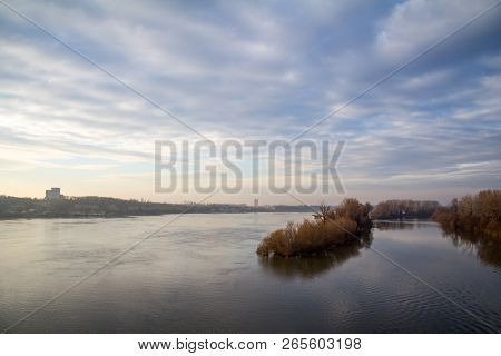 Danube Shores In Zemun, Suburb Of Belgrade, Serbia, During The Autumn, With The River In Foreground,
