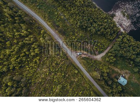 Car Leaving The House In The Forest Seen From The Sky, Lapland Finland