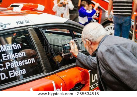 Paris, France - Oct 4, 2018: Adult Customers Curious People Admiring New Sport Rally Citroen C2 Wrc 