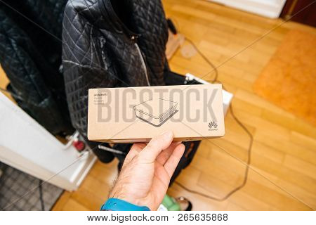 Paris, France - Jan 15, 2018: Pov At Technician Hand Holding Huawei Optical Network Terminal During 