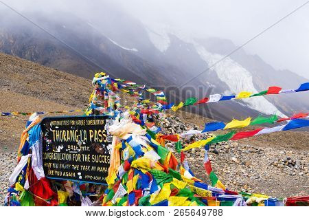 Information Sign And Prayer Flags On Thorang-la Pass, Annapurna Conservation Area, Nepal