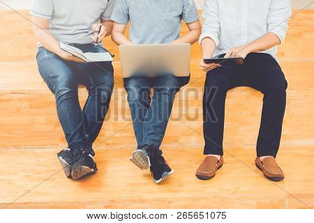 High School Or College Students Studying And Reading Together In Library