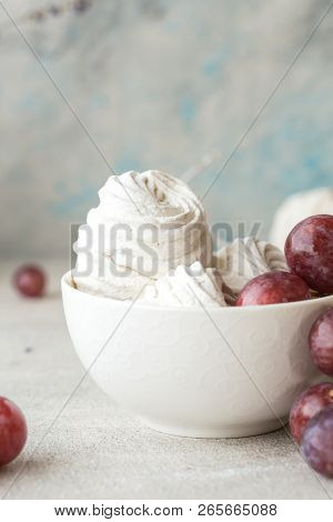 Marshmallow Or Zefir Dessert In Box On White Plate With Grape