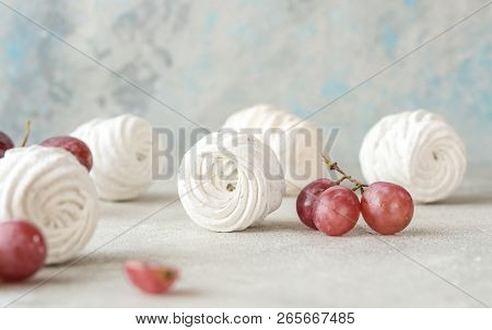 Grape  Zephyr On White Wooden Background. Set Of Homemade Russian Zephyr Or Marshmallow On Wooden Ba