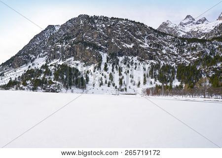 Panticosa snow frozen lake ice in Huesca Pyrenees of Spain