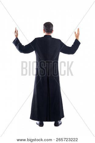Full length priest blessing arm rear view of back soutane