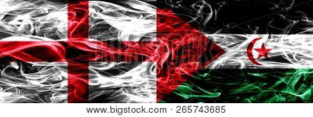 England Vs Sahrawi Smoke Flags Placed Side By Side. Thick Colored Silky Smoke Flags Of English And S