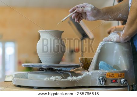 Creating A Jar Or Vase Of White Clay Close-up. Master Crock. Man Hands Making Clay Jug Macro. The Sc
