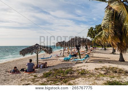 Playa Ancon, Cuba - Feb 9, 2016: Tourists Sunbathing At Playa Ancon Beach Near Trinidad, Cuba