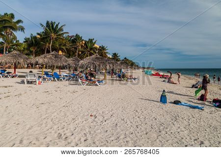 Playa Ancon, Cuba - Feb 9, 2016: Tourists Sunbathe At The Beach Playa Ancon Near Trinidad, Cuba