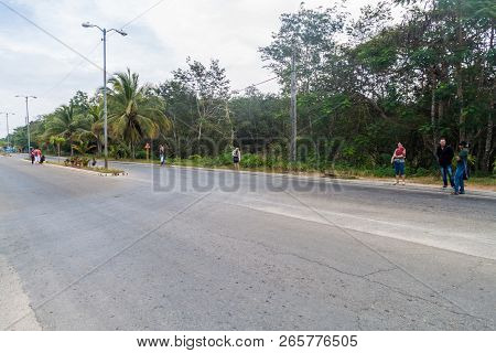 Playa Larga, Cuba - Feb 16, 2016: Hitchhikers Wait At A Roadside In Playa Larga Village, Cuba.
