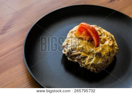 Turkish Bohca Kebab / Crepe With Cubed Meatball And Vegetables.