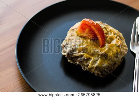 Turkish Bohca Kebab / Crepe With Cubed Meatball And Vegetables.