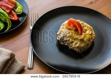 Turkish Bohca Kebab / Crepe With Cubed Meatball And Vegetables.
