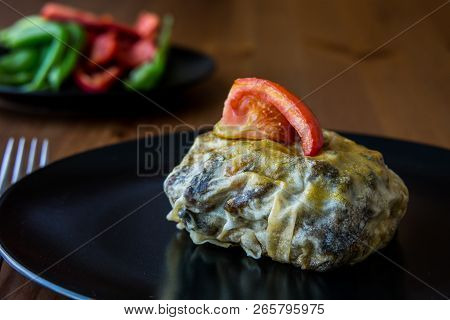 Turkish Bohca Kebab / Crepe With Cubed Meatball And Vegetables.