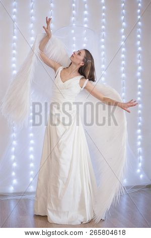 Girl In White Dress With Angel Wings On White Background. Angel-woman