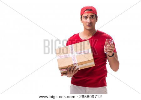 Handsome contractor holding fragile box isolated on white 