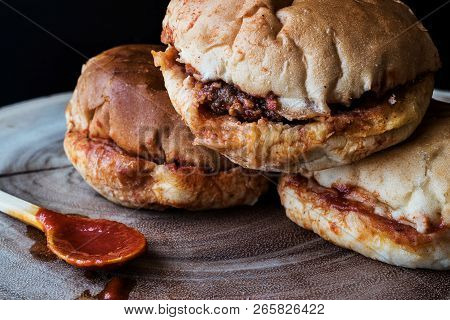 Turkish Wet Burger With Sauce / Islak Hamburger On A Wooden Surface.