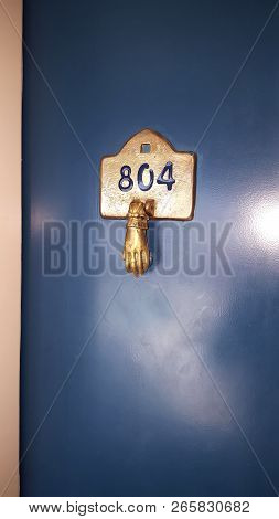 Hand Cooper Knocked Doorbell In Retro Style.