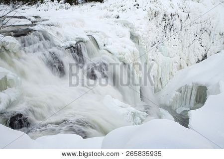 frozen waterfall Tannforsen in winter, Sweden