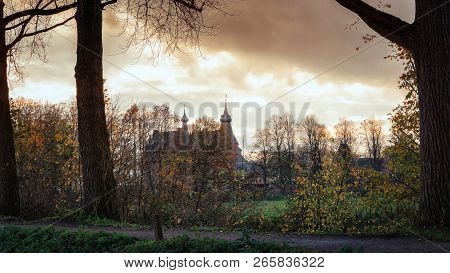 The Dutch Castle Doorwerth That Can Be Seen Behind A Row Of Trees Under A Spectacular Sky