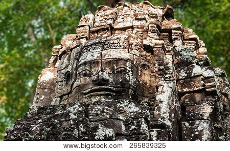 Ancient Carved Smiling Buddhist Face Of Lokeshvara On Western Entrance Of Ta Som Temple Of Angkor Wa