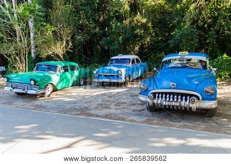 Vinales, Cuba - Feb 18, 2016: Vintage Taxis At The Entrance To Cueva Del Indio Cave In Vinales Valle