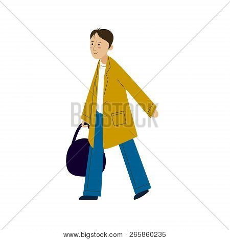 The Guy In The Raincoat Comes With A Bag In His Hand. A Young Man In A Cloak Walking.