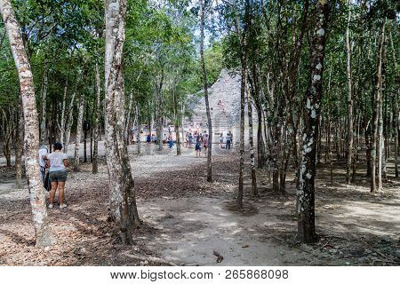 Coba, Mexico - March 1, 2016: Tourist Visit The Pyramid Nohoch Mul At The Ruins Of The Mayan City Co