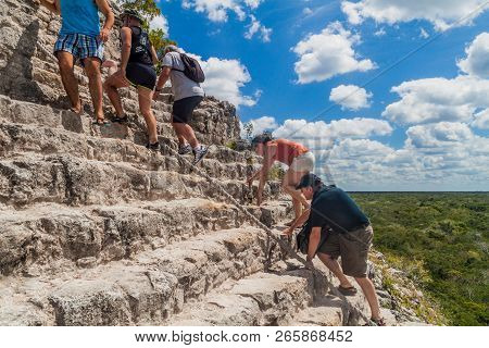 Coba, Mexico - March 1, 2016: Tourist Climb The Pyramid Nohoch Mul At The Ruins Of The Mayan City Co