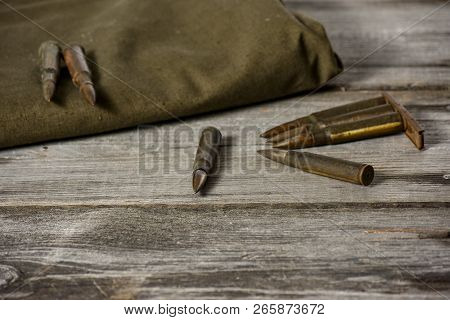 7, 92 X 57 - Rustic Ammos And Poncho Lies On The Wooden Background