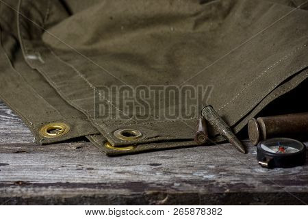 7, 92 X 57 - Rustic Ammos, Poncho And Old Flashlight Lies On The Wooden Background