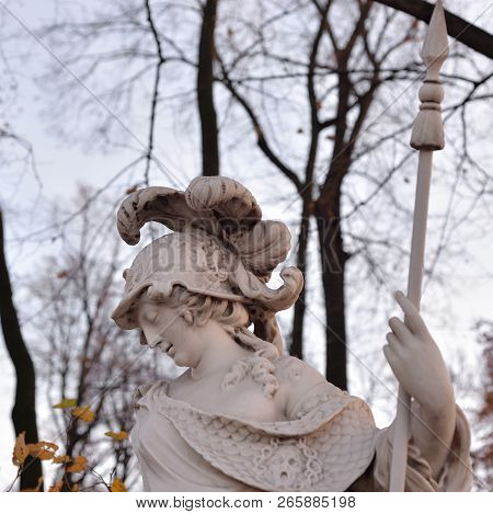 Goddess Minerva Statue In Summer Garden At Autumn Evening, St.petersburg, Russia. Minerva Is The God