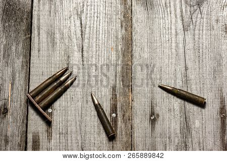Disassembled Clip With Cartridges 7, 92 X 57 - Rustic Ammos Lies On The Wooden Background