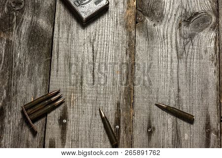 Disassembled Clip With Cartridges 7, 92 X 57 - Rustic Ammos Lies On The Wooden Background
