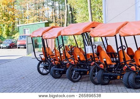 Many Fashionable Orange Four-wheeled Sports Bicycles, Cycle Cards For Family Sports Recreation And T
