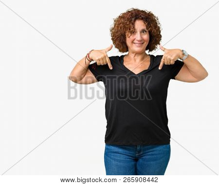 Beautiful middle ager senior woman over isolated background looking confident with smile on face, pointing oneself with fingers proud and happy.
