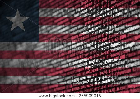 Liberia Flag  Is Depicted On The Screen With The Program Code. The Concept Of Modern Technology And 