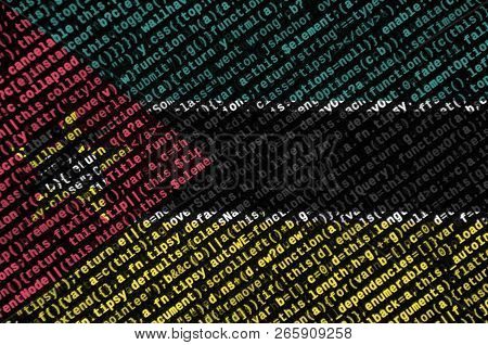 Mozambique Flag  Is Depicted On The Screen With The Program Code. The Concept Of Modern Technology A